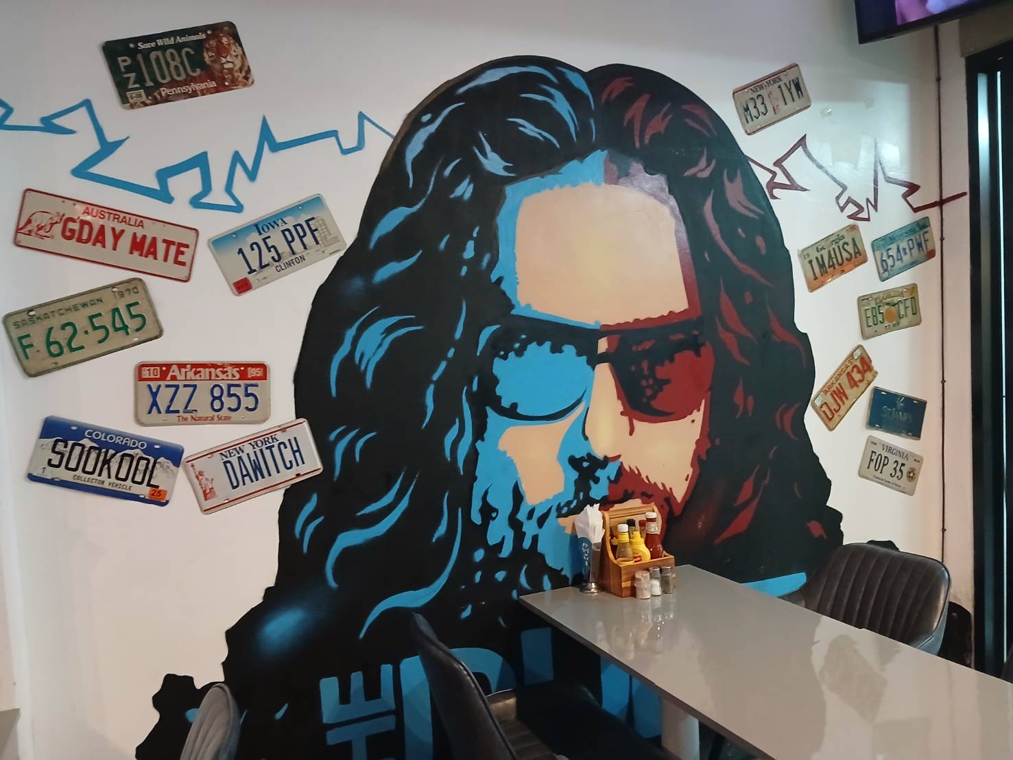 Blue and red street-art mural inside Pancake Palace
