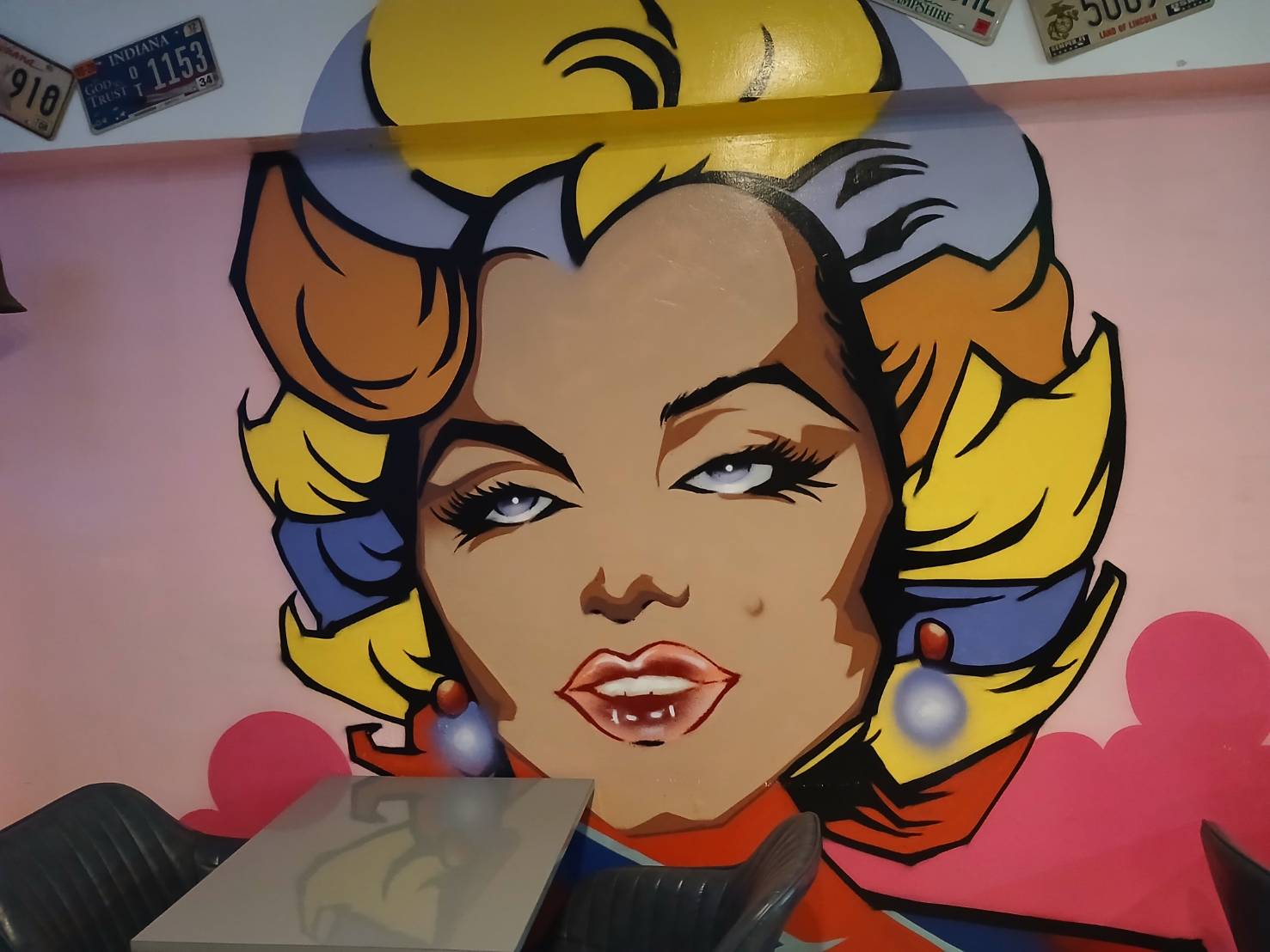 Colourful pop-art portrait mural inside Pancake Palace